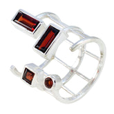 Elena silver ring featuring four red gemstones in a unique open signet ring design