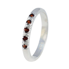 Yuki elegant red gemstone silver ring with five small round red gemstones on a polished silver band