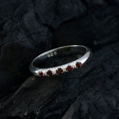 Yuki red gemstone silver ring featuring five small red gemstones set in a sleek silver band