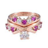 Naomi rose gold V chevron stacking ring set with pink and clear stones and solitaire center red gemstone stacking ring