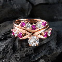 Naomi red gemstone stacking ring in rose gold with center solitaire diamond and pink ruby accents