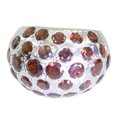 Josephine red gemstone statement ring with multiple round red gemstones set in silver band