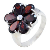 Luna red gemstone statement ring with five dark red petals set in silver band floral design