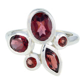 Bianca red gemstone statement ring with multiple faceted red stones set in silver band