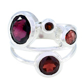 Nisa red gemstone statement ring with multiple deep red stones set in polished silver band