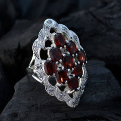 Pauline red gemstone statement ring with multiple oval red stones set in intricate silver design