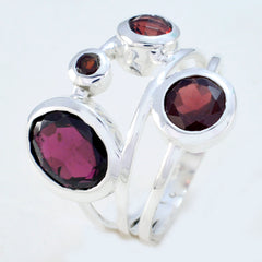 Nisa red gemstone statement ring with multiple oval red stones set in silver bands