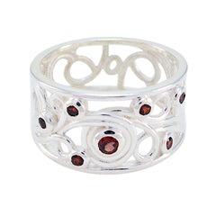 Kristine silver ring featuring intricate design with red gemstone statement ring accents