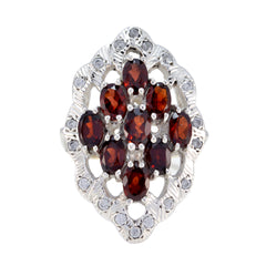 Pauline red gemstone statement ring with multiple oval red stones and silver decorative setting