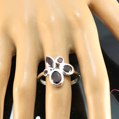 Bianca red gemstone statement ring with multiple deep red stones on silver band