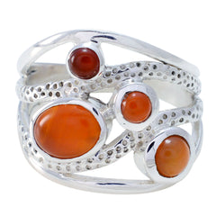 Autumn red gemstone statement ring with multiple polished red stones set in textured silver band