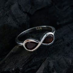 Tereza red gemstone toi et moi ring with two deep red stones set in a silver band