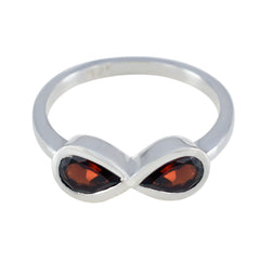 Silver ring featuring a red gemstone toi et moi ring design with two marquise-cut stones