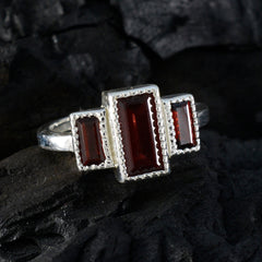 Charlotte red gemstone trilogy ring with three rectangular deep red stones set in silver band