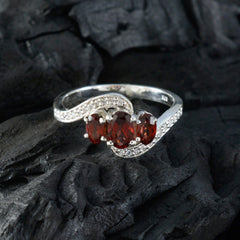 Xiu sterling silver red gemstone trilogy ring with three oval garnet stones and pave diamond accents