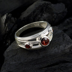 Julieta red gemstone trilogy ring with three red stones set in a sterling silver band