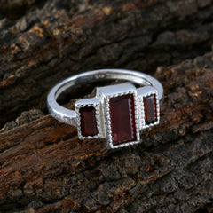Charlotte red gemstone trilogy ring with three rectangular red stones set in silver band