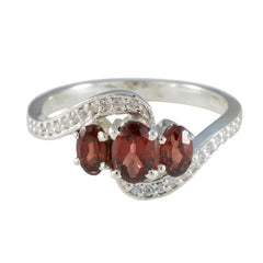 Xiu red gemstone trilogy ring with three oval red stones and pave accented sterling silver band