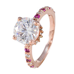 Li Lee red halo gemstone ring with large clear center stone and small red and white stones on rose gold band