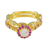 Laura gold ring featuring a red halo promise ring design with red and clear gemstones