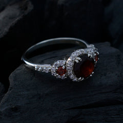 Maria red halo ring for women with central red gemstone haloed by diamonds on sterling silver band