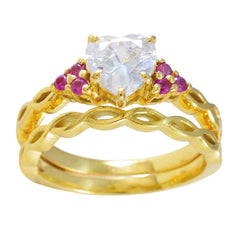 Saanvi red halo ring for women in gold with heart-shaped clear center stone and small red gemstones