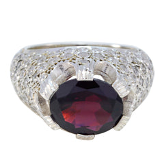 Aria red halo ring for women with a large oval red gemstone set in a silver band with intricate detailing