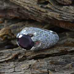 Aria red halo ring for women with a large red gemstone and silver band encrusted with smaller stones