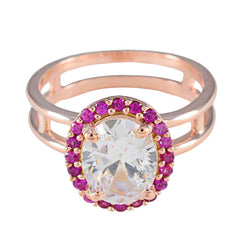 Josephine red halo ring for women with oval clear center stone and pink gemstone halo in rose gold band
