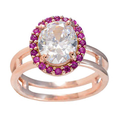 Josephine red halo ring for women with large oval clear center stone and small red stones in rose gold band