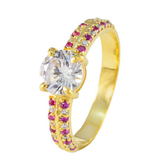 Xiu red halo ring gold with round clear center stone and small red and white stones on gold band