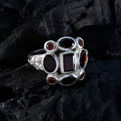 Joaquina red navratna ring sterling silver band with central square and surrounding oval red gemstones