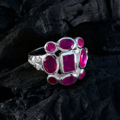 Eva red navratna ring with multiple oval and square red gemstones set in silver