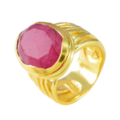 Lara gold band red solitaire ring with bezel set faceted ruby style gemstone and ribbed shank