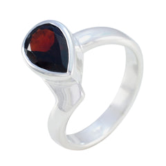 Priya elegant red solitaire ring with pear-shaped red gemstone set on smooth silver band