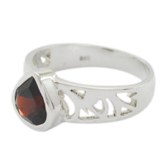 Renata red solitaire ring for women with a deep red gemstone and silver cutout band design