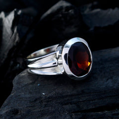 Bianca red solitaire ring for women with a large faceted red gemstone set in a silver band