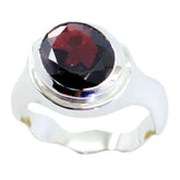 Riley red solitaire ring for women with a large faceted red gemstone and silver band