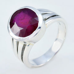 Kristine red solitaire ring for women with a round deep red gemstone set in silver band
