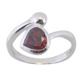Stella silver ring featuring a heart-shaped red solitaire ring gemstone with modern swirl design