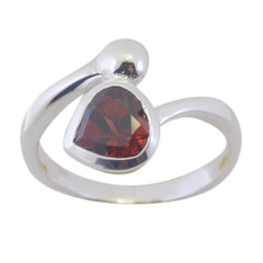 Stella silver ring featuring a heart-shaped red solitaire ring gemstone with modern swirl design