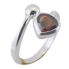 Stella silver ring featuring a heart-shaped red solitaire ring gemstone on an open band design