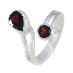 Lara silver red toi et moi ring featuring two deep red gemstones in an open band design