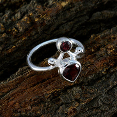 Savannah silver ring featuring a red toi et moi ring design with two red gemstones