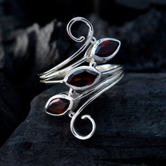 Ayesha red trilogy gemstone ring with three marquise red stones set in silver swirled band