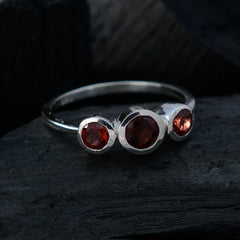 Wen sterling silver red trilogy gemstone ring with three round garnet stones on a slim band