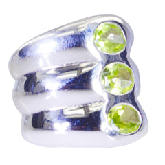 Ines retro green gemstone ring with three round green gemstones set in a polished silver band