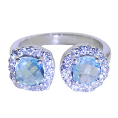 Josephine romantic blue toi et moi ring with two blue gemstones and surrounding diamonds