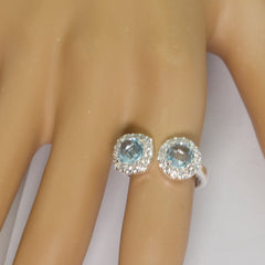 Josephine romantic blue toi et moi ring with two blue gemstones and surrounding diamonds on hand