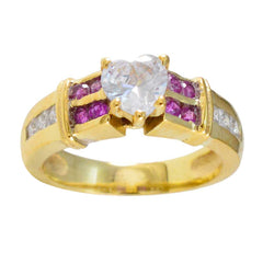 Daniela romantic red halo ring with heart-shaped center stone and gold band accented with red and clear gemstones